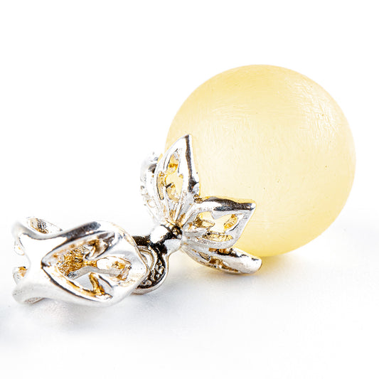 Stylish, classic elegance made from a perfect amber ball in white yellow on a sterling silver setting