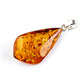 Amber pendant with a slightly cubic teardrop shape