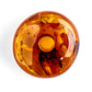 A “Solar Plexus Donut” pendant made from natural Nordic amber