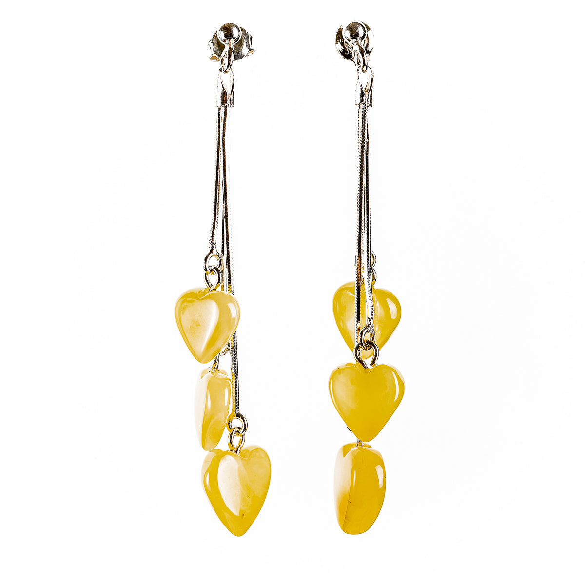 Earrings (chains) each with three hearts made of natural Nordic amber, in the colors buttermilk to ivory