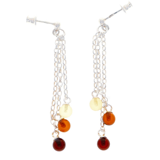 Stud earrings with hanging chains made of sterling silver, each with three global amber beads