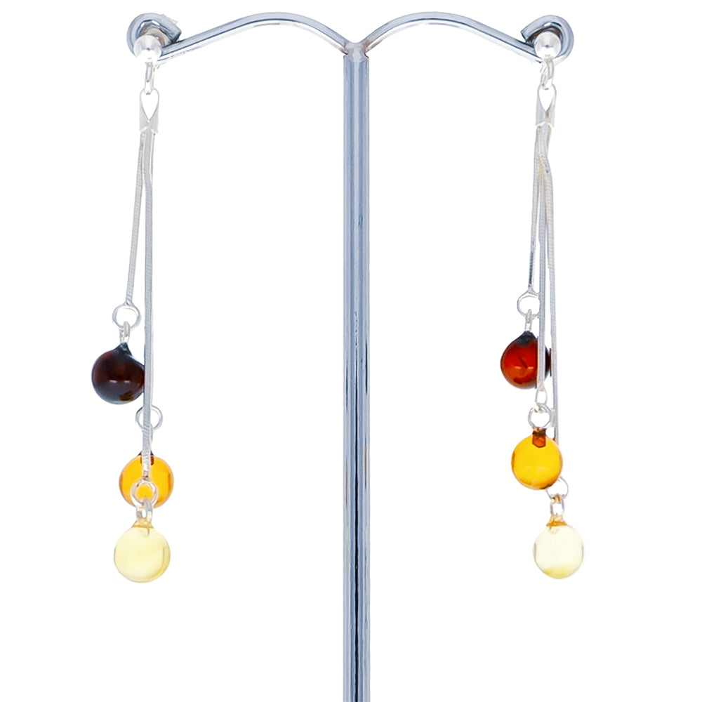 Stud earrings with hanging chains each equipped with three small global amber beads