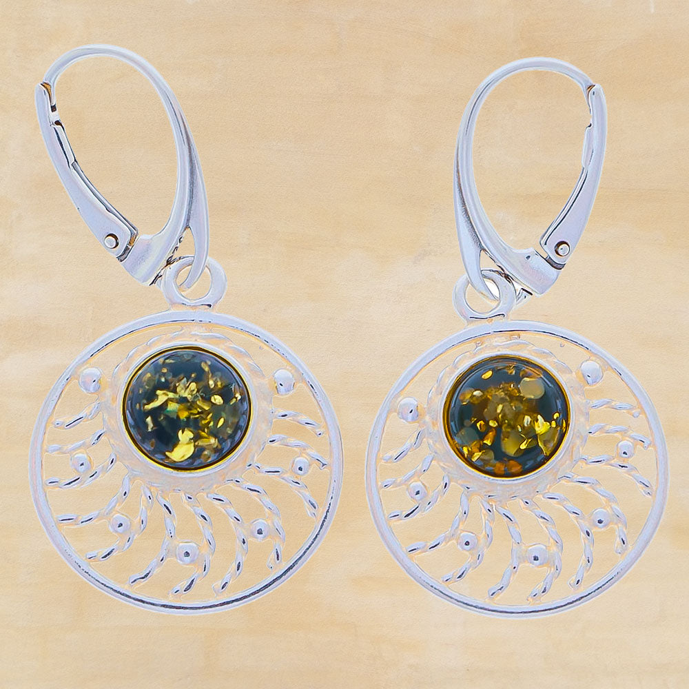 Sunny earrings each with shiny amber beads with a mossy interior