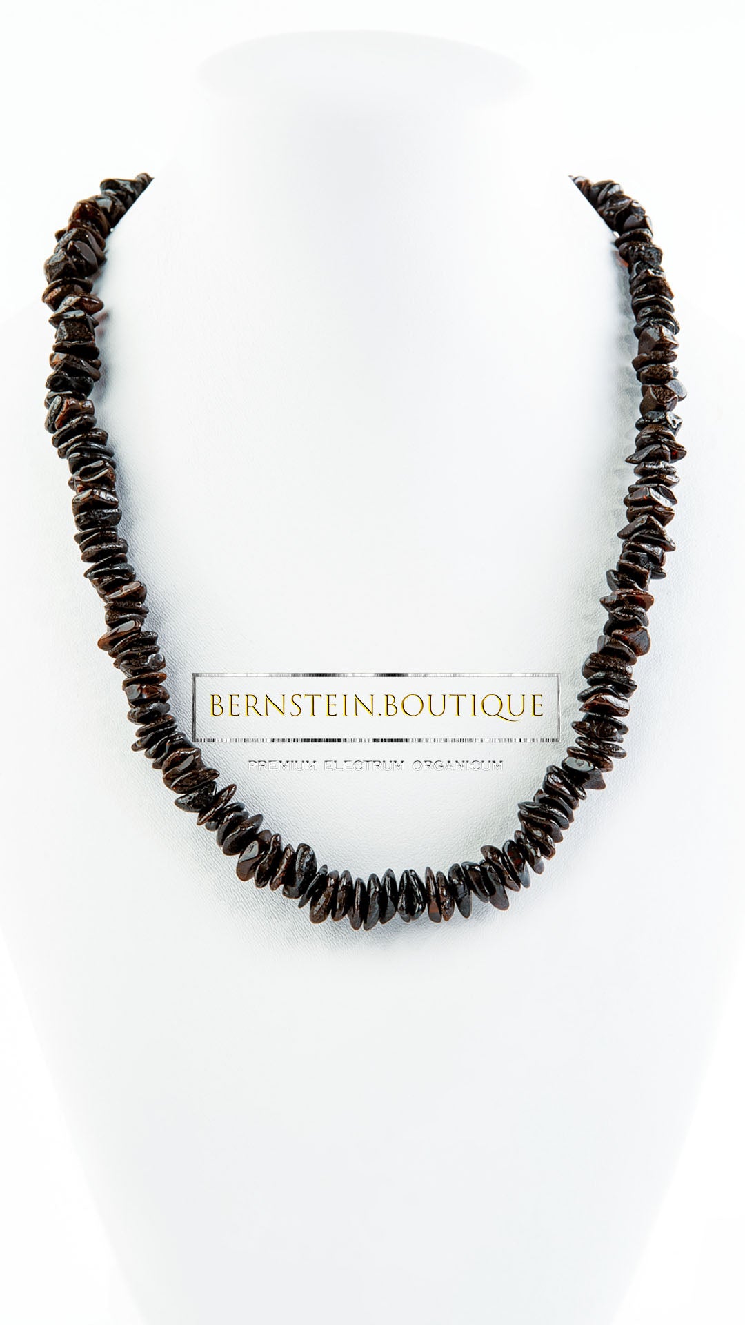 Necklace made of shiny polished natural amber chips in darker shades of natural amber.