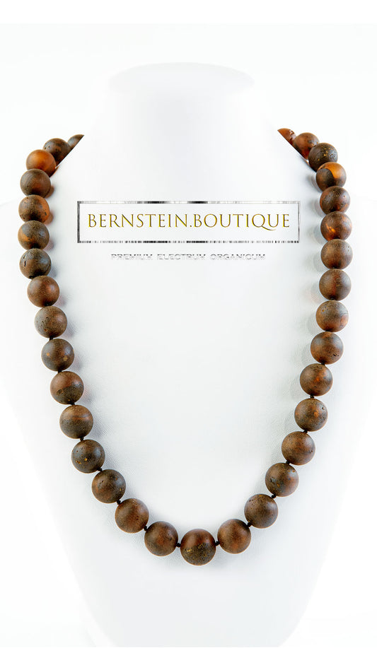 Necklace made of naturally dark red baroque amber beads