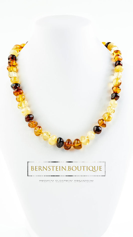 Necklace with multiple natural amber colors, hand polished baroque shape beads.