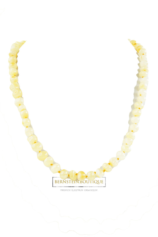 Classic "ivory" necklace made of baroque natural amber beads