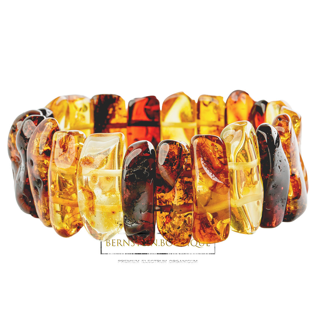 Bracelet made of shiny polished amber - "chunkies" in gold-yellow, honey-gold and dark red