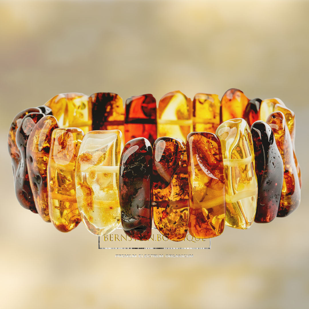 Bracelet made of shiny polished amber - "chunkies" in gold-yellow, honey-gold and dark red