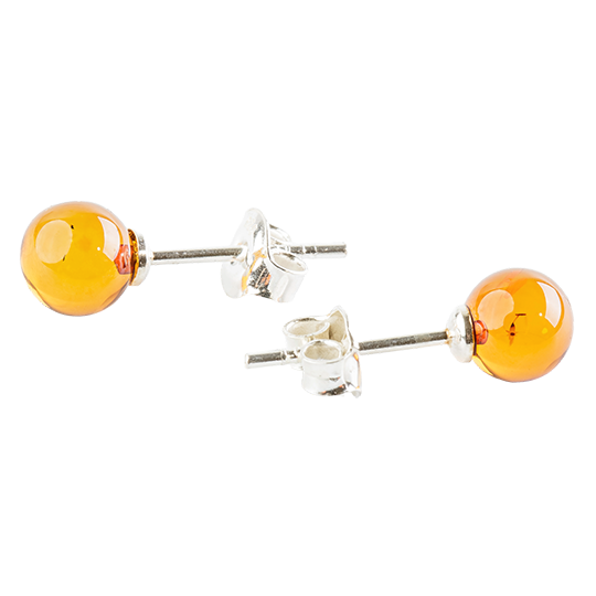 Shiny, partially transparent stud earrings with honey-gold to orange peel amber beads