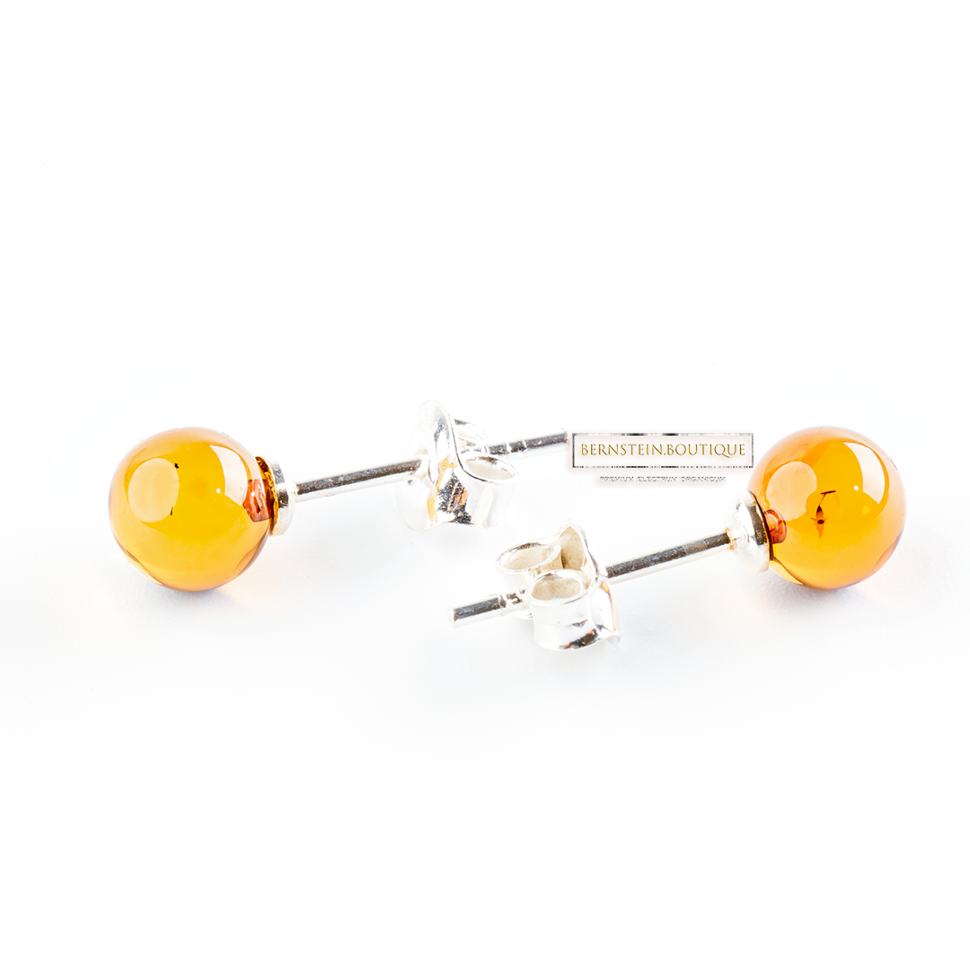 Stud earrings made of two shiny yellow balls made of natural Nordic Amber, ..