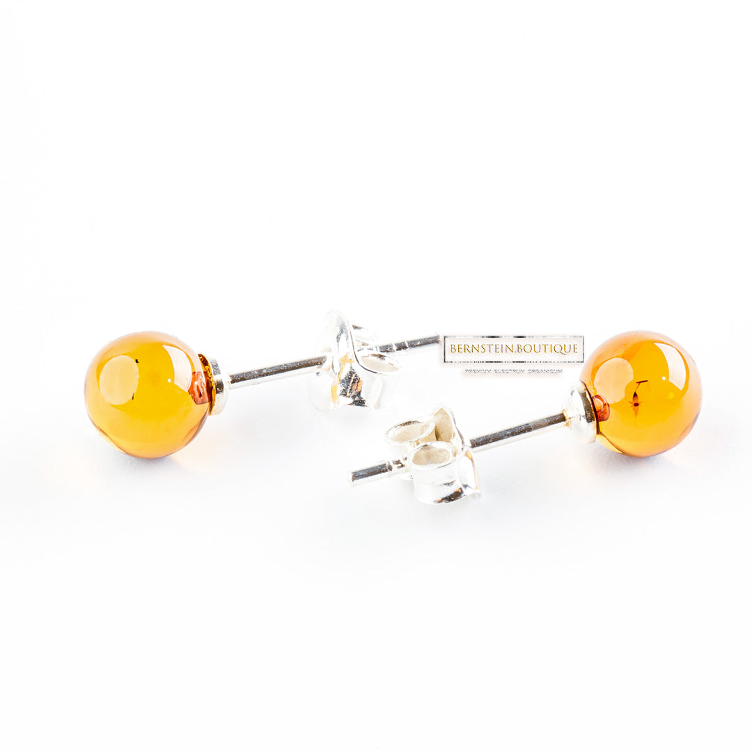 Stud earrings made of two shiny yellow balls made of natural Nordic Amber, ..