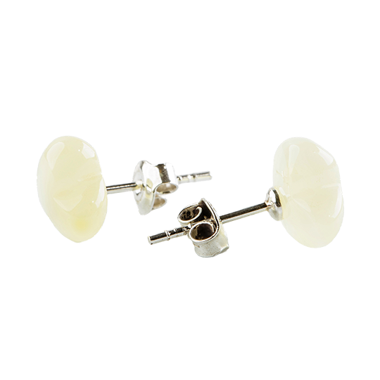 Stud earrings made of amber pearls in a cute silhouette in a natural color around pearl white. .