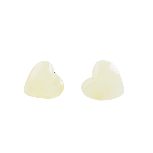 Stud earrings made of amber pearls in a cute silhouette in a natural color around pearl white. .