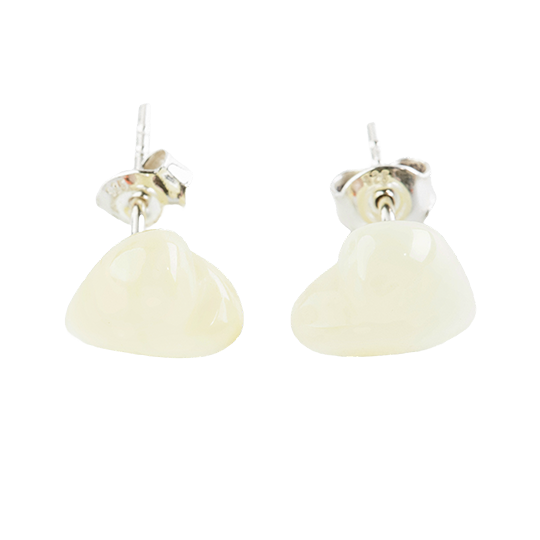 Stud earrings made of amber pearls in a cute silhouette in a natural color around pearl white. .