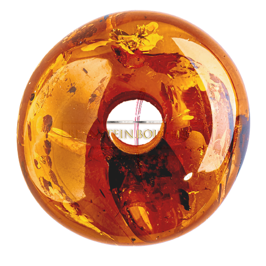 A “Solar Plexus Donut” pendant made from natural Nordic amber