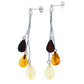 Stud earrings with hanging silver chains, each with three amber beads