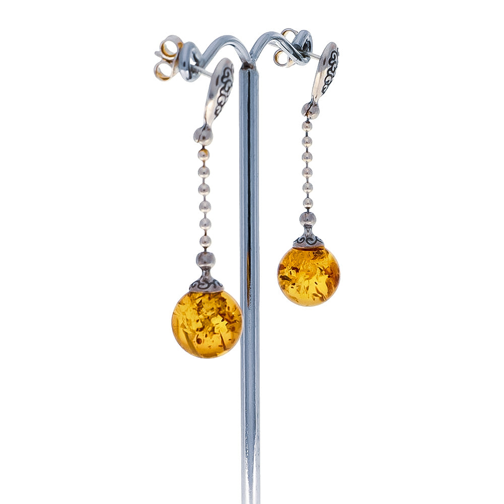 Hanging stud earrings with perfectly global and "sunny" amber beads