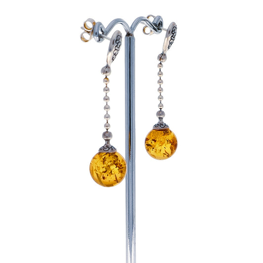 Hanging stud earrings with perfectly global and "sunny" amber beads