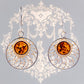 Sunny earrings with a central celestial amber bead set in sterling silver