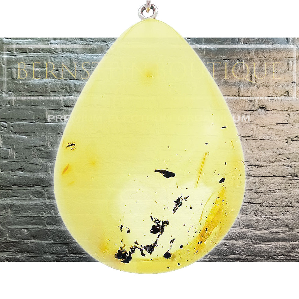 Pastel gold pendant made of real amber