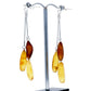 Stud earrings with hanging chains, each with three grain-shaped amber beads