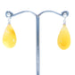 Stud earrings made of "pear beads" from natural amber on sterling silver