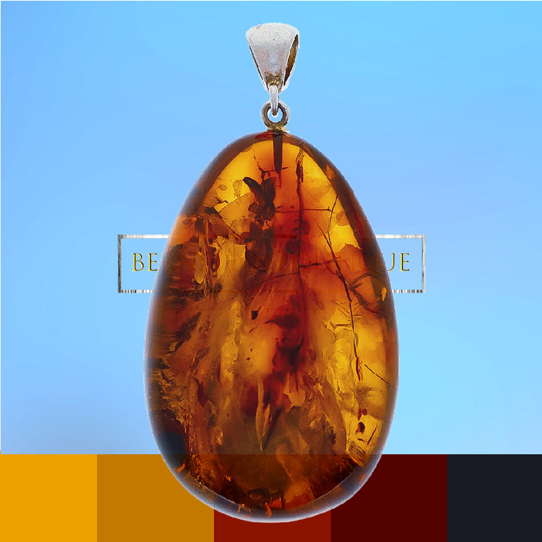 Oval and transparent pendant made of amber