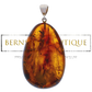 Oval and transparent pendant made of amber