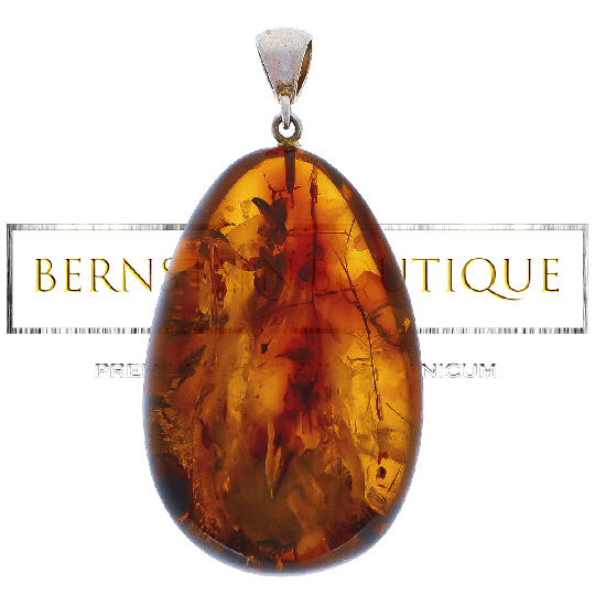 Oval and transparent pendant made of amber