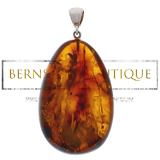 Oval and transparent pendant made of amber