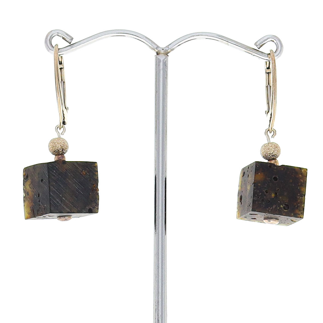 Polished bog amber cubic cut earrings set in sterling silver