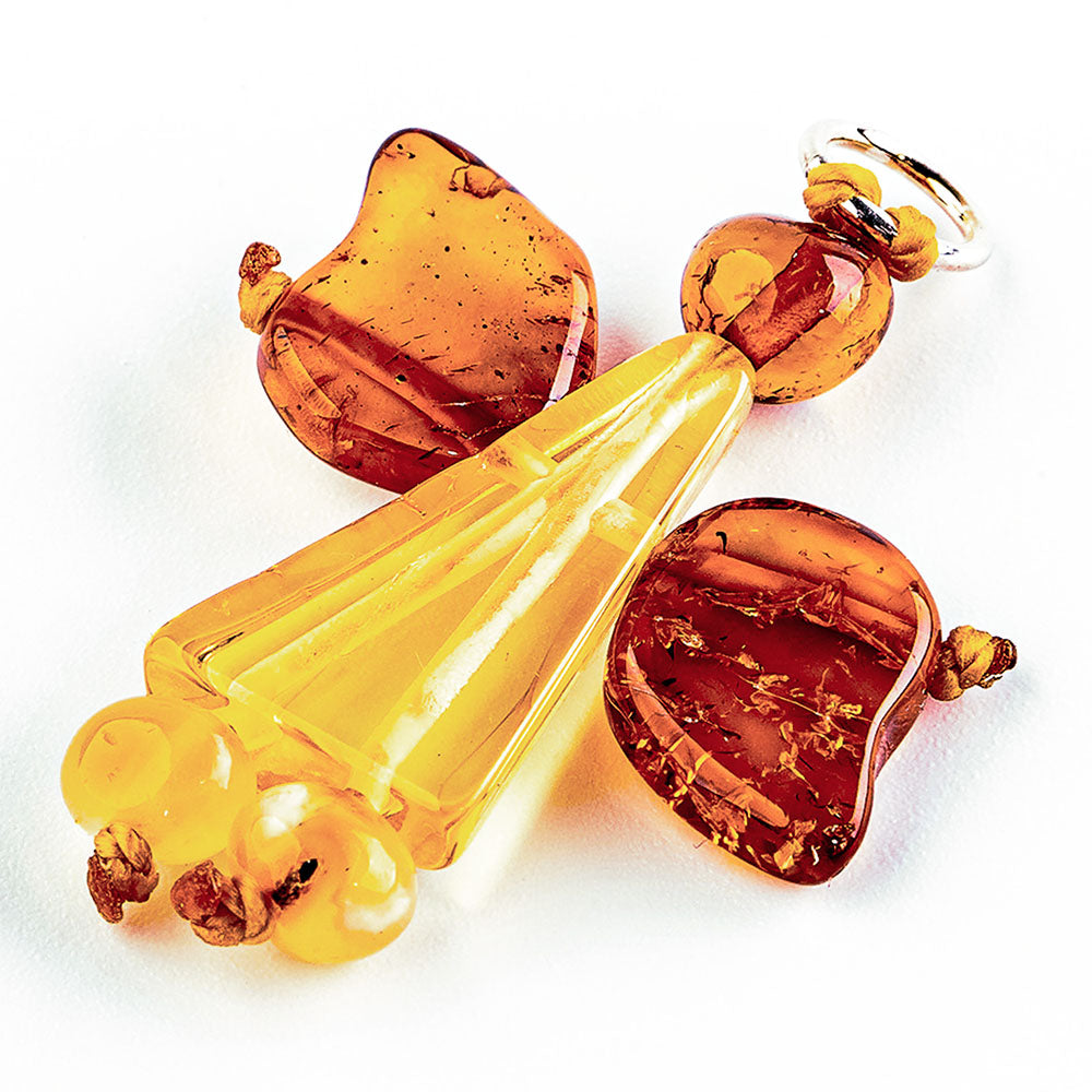 Angel pendant made of Nordic natural amber - in the natural colors honey yellow and chestnut